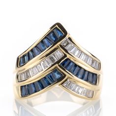 This piece from the late 20th century combines boldness with elegance. This is achieved through the solid yet graceful design crafted from heavy yellow gold, elegantly combining sapphires and baguette-cut diamonds. Metal 14k / 0.585 gold Gemstones 22 sapphires 0.70ct 21 diamonds 0.50ct Measurements Head 16.5mm Shank 4.2mm Ring size 7 US / 54 EU Weight 5.6g Condition Pre-owned, very good conditions   General Information All items come with certificate of authenticity, gemstones have been tested a Elegant Gold Sapphire Ring With Baguette Diamonds, Yellow Gold Sapphire Ring With Baguette Diamonds, Fine Jewelry Sapphire Ring With Baguette Diamonds, Sapphire Ring With Baguette Diamonds, Baguette Cut Diamond, Fabulous Jewelry, 14k Gold Ring, Multi Stone Ring, Multi Stone