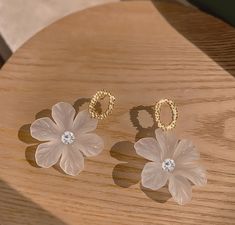 The Floral acrylic earrings are not only beautiful but also versatile, suitable for both casual and formal occasions. They are lightweight and comfortable to wear, making them a perfect accessory for any outfit. These gorgeous white earrings are the perfect gift for anyone who appreciates natural beauty and unique jewelry. Free Estimated Delivery: 3-4 Days Delivery White Earrings, Floral Earrings, Acrylic Earrings, Large Flowers, Flower Shape, Jewelry Earrings Studs, Timeless Fashion, Natural Beauty, Jewelry Collection