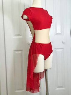 a mannequin wearing a red top and skirt