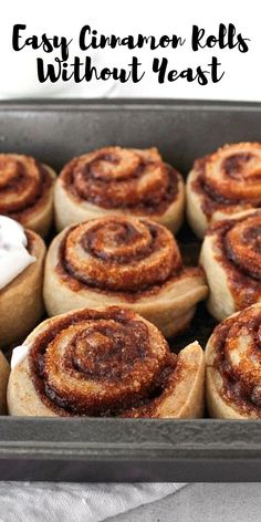 cinnamon rolls in a baking pan with icing