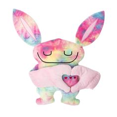 a stuffed animal with a heart on it's chest is wearing a tie dye bunny costume