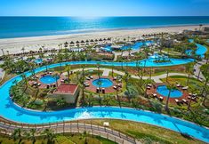 an aerial view of the beach and pool area at hilton's oceanfront resort