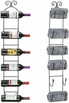 two racks with wine bottles and towels hanging from them