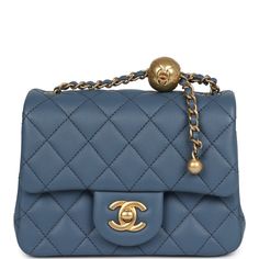 This Chanel mini square pearl Flap Bag is of blue lambskin leather with antique gold tone hardware, has a front flap with signature CC turnlock closure, tonal stitching, rear half moon pocket, a single interwoven blue leather and antique gold tone chain link shoulder/crossbody strap and a pearl and chain top handle strap.The Interior is lined in blue lambskin leather and has one slip pocket on back wall.Collection: 2023 (RFID Chip)Origin: ItalyCondition: New and never Accompanied by: Chanel box, Chanel dustbag, RFID Measurements: 7" width x 5" height x 3" depth; 21" strap drop Chanel Mini Square, Chanel Box, Chanel Pearls, Chanel Mini, Chain Top, Trending Handbag, Unique Bags, Blue Pearl, Bags Designer Fashion