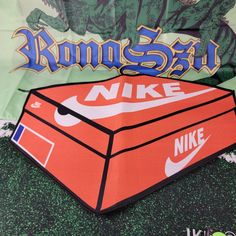 Elevate Your Home Decor With This Stylish Nike Shoe Box Rug. The Vibrant Orange Color And Art Deco Style Make It A Perfect Addition To Any Room. The Rug Is Made Of High-Quality Microfiber Material That Is Wear-Resistant, Antistatic, And Allergy-Friendly. It's Easy To Clean, Dryable, And Non-Slip, Making It A Versatile Choice For Any Home. This Area Rug Measures 32in In Length And 23in In Width, With A Normal Pile Type And A Machine-Woven Weave. The Rug Is Perfect For Those Who Appreciate Eco-Fri Nike Shoe Box, Shaped Rug, Nike Shoe, Orange Shoes, Allergy Friendly, Vibrant Orange, Art Deco Style, Deco Style, Shoe Box