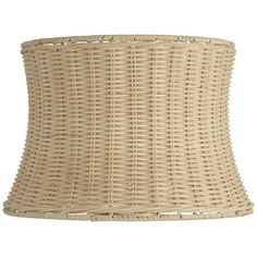 a wicker lamp shade on a white background