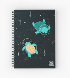 a spiral notebook with an image of two sea turtles floating in the sky and stars