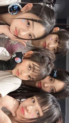 four girls are posing for the camera with their hair in ponytails and piercings