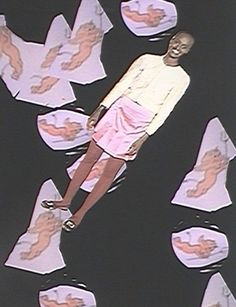 a man standing in the middle of papers floating around