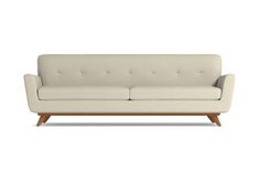 a white couch sitting on top of a wooden frame