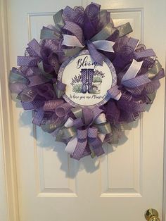 a purple and silver wreath on the front door