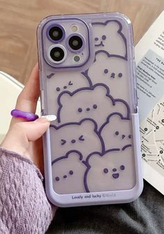 someone is holding their cell phone case with an animal design on it