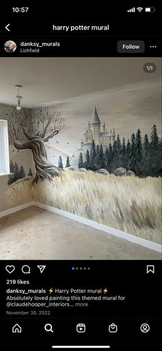 an empty room with a painting on the wall and trees painted on the walls in it