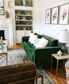 a living room filled with furniture and a fire place in front of a white fireplace