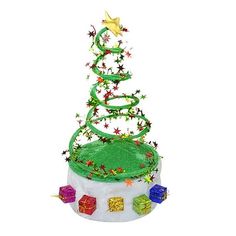 a green christmas tree on top of a white cake covered in stars and ribbons with presents around it