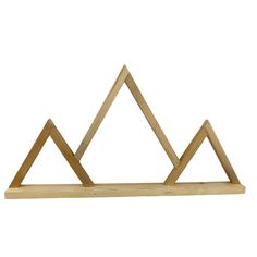 a wooden shelf with three triangles on it