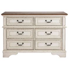 an antique white dresser with drawers and wood top