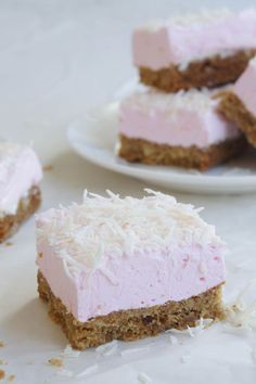 several pieces of cake sitting on top of a white plate next to another piece of cake