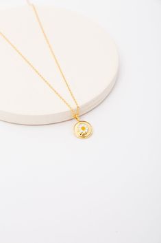 Daisy Gold Necklace WOMEN'S NECKLACE Cove Gold Necklace With Flower Charm Round Pendant, Gold-plated Necklaces With Round Flower Charm Pendant, Gold Plated Necklace With Flower Charm Pendant, Gold Plated Necklace With Flower Charm And Round Pendant, Gold Flower Necklace With Adjustable Chain, Gold Charm Necklace With Flower Charm, Gold Necklaces With Round Flower Charm, Gold Round Necklaces With Flower Charm, Getaway Dress