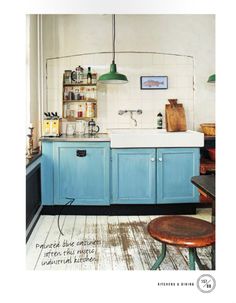 an old kitchen with blue cabinets and white counter tops is featured in the magazine's march / june 2012 issue