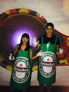 two people dressed up in green beer costumes