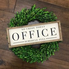 a sign that says no criss today office schedule full on top of a wreath