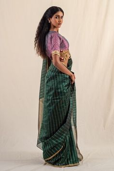 Green silk chanderi saree with gold zari striped work. Comes with an unstitched blouse piece. - Aza Fashions