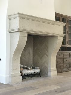 a fireplace in a living room with white walls