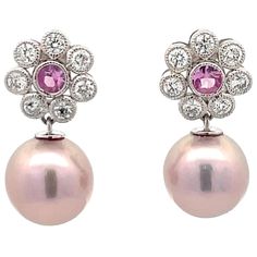 14 Karat White Gold drop earrings featuring two Pink Sapphires weighing 0.40 Carats surrounded by 14 round brilliants, 0.40 carats, and two pink Freshwater pearls measuring 10-11 MM. Pearls earrings can be changed to Tahitian, Pink, Gold or South Sea DM for more videos and pictures on my ear. Search Harbor Diamonds Formal Pink Diamond Earrings, Classic Pink Diamond Earrings For Formal Occasions, Elegant Pink Diamond Earrings For Anniversary, Classic Pink Akoya Pearl Jewelry, Classic Pink Gemstone Earrings, Classic Pink Earrings For Formal Occasions, Pink Round Cut Earrings For Formal Occasions, Classic Pink Dangle Jewelry, Classic Pink Dangle Earrings