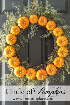 an orange pumpkin wreath on a black door with the words, diy fall wreath