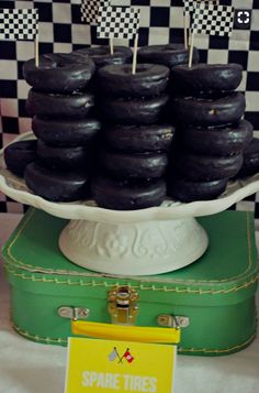 black donuts are stacked on top of each other