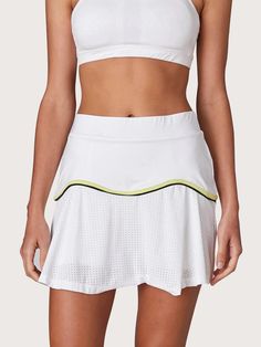 White with a yellow & navy trim detail, the Performance Team Skort is breathable, comfortable and made for movement. Finished with built-in gusseted under shorts, this skort is ideal for the active tennis player. Size + Fit Please reference L'Etoile Sport Mid to high-rise with a sporty length Material + Care Made from high quality performance stretch fabric and white modern perforated mesh trim Under Shorts, White Mini Skirts, Golf Dresses, Tennis Player, Mesh Skirt, Tennis Clothes, Tennis Dress, New Line, Skirt Design