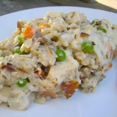 a white plate topped with rice and vegetables