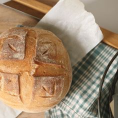 a loaf of bread sitting on top of a wooden table