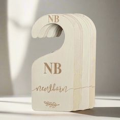 a wooden block with the letter nb on it's front and back sides