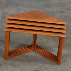 three wooden tables stacked on top of each other in the shape of hexagons