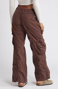 Tap into the retro look you missed the first time around in these all-cotton cargo pants featuring commodious bellows pockets to hold most everything you need. Exclusive retailer 31" inseam; 23 1/2" leg opening; 9 1/2" front rise; 13 1/2" back rise (size Medium) Back elastic waist 100% cotton Machine wash, line dry Made in Turkey Baggy Cargo Pants For Women, Wide Leg Cargo Jeans With Multiple Pockets For Outdoor, Y2k Fall Cargo Pants With Pockets, High Waist Cargo Pants With Hip Pockets For Outdoor, Y2k Cargo Style Bottoms For Fall, Wide Leg Cargo Jeans For Outdoor Activities, Fall Y2k Cargo Pants, Brown Full-length Cargo Bottoms, Brown Cargo Style Full Length Bottoms