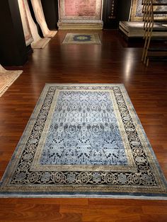 a large rug is on the floor in a room