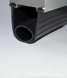 an aluminum pipe is shown with the end cut out to show it's metal profile