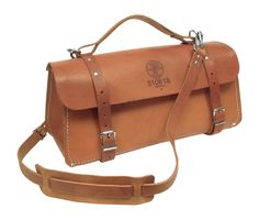 Store your tools inside the deluxe leather tool bag. It's durably made and has a padded shoulder strap. Leather Tool Bag, Belt Storage, Tool Tote, Tooled Leather Bag, Tool Bags, Klein Tools, Work Style, Tool Bag, Leather Projects