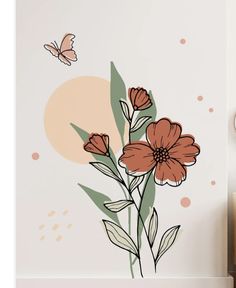 an orange flower and butterfly wall decal on a white wall with pink polka dots