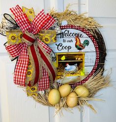 a welcome to our coop door hanger with eggs and hay on the front door