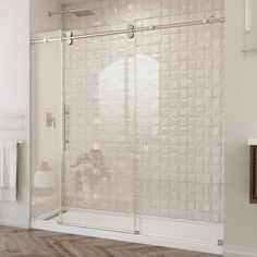 a bathroom with a glass sliding shower door