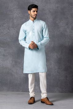 Powder blue kurta with front button placket. Paired with churidar.
Components: 2
Fabric: Cotton
Neckline: Mandarin
Sleeve Length: Full
Color: Blue
Mother of pearl buttons - Aza Fashions Blue Lawn Suit With Naqshi For Diwali, Light Blue Straight Kurta For Diwali, Blue Naqshi Straight Kurta Traditional Wear, Light Blue Long Sleeve Kurta With Dabka, Traditional Light Blue Dabka Kurta, Light Blue Dabka Embellished Long Sleeve Kurta, Light Blue Long Sleeve Dabka Kurta, Designer Light Blue Kurta For Eid, Blue Long Sleeve Kurta With Naqshi