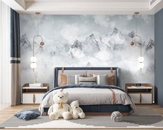 a bedroom with a mountain mural on the wall and two teddy bears sitting in front of it