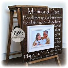 a wooden frame with a picture of a man and woman holding wine glasses