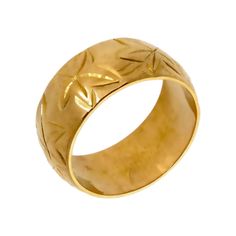 a gold ring with leaves on it