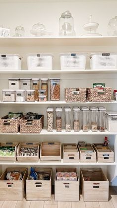 an organized pantry with bins and baskets