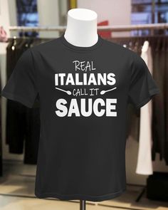 a black shirt that says real italians call it sauce