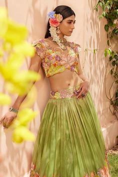 Green kota lehenga with multicolored floral applique embroidery and attached cancan. Paired with a padded embroidered blouse and dupatta.
Components: 3
Pattern: Embroidered
Type Of Work: Floral embroidery
Neckline: V Neck
Sleeve Type: Cap sleeves
Fabric: Kota
Color: Green
Other Details: 
Dual toned dupatta
Length:
Blouse: 15.5 inches
Lehenga: 48 inches
Occasion: Destination Wedding, Wedding - Aza Fashions Green Palazzo Set With Unstitched Blouse For Wedding, Green Palazzo Set With Unstitched Blouse For Reception, Pista Green Sets For Reception Navratri, Pista Green Sets For Reception And Navratri, Pista Green Sets For Reception During Navratri, Green Palazzo Set With Unstitched Blouse For Festivals, Green Palazzo Set With Intricate Embroidery For Reception, Green Embroidered Palazzo Set For Reception, Bollywood Style Pista Green Choli With Unstitched Blouse